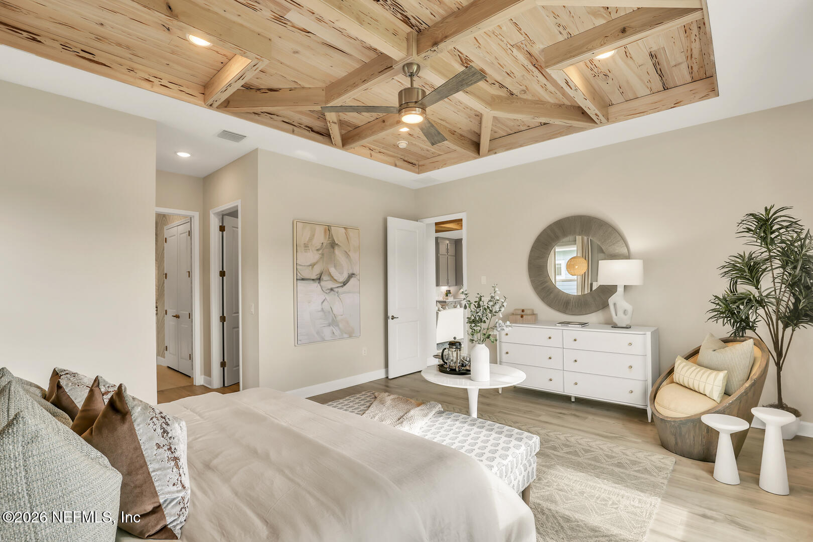 44 Ribera Drive Flagler Beach, FL 32136 - Photo 22 of 26 a bedroom with a bed and wooden floor