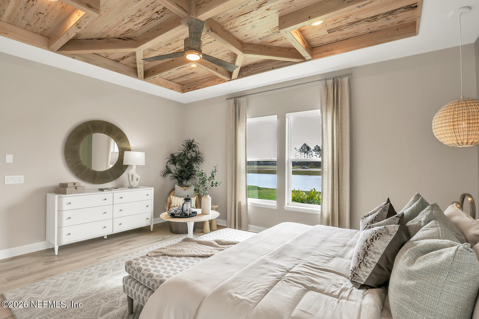 44 Ribera Drive Flagler Beach, FL 32136 - Photo 23 of 26 a bedroom with a bed a dresser and mirror