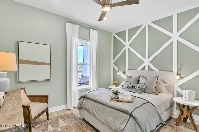 a bedroom with a bed and a chair