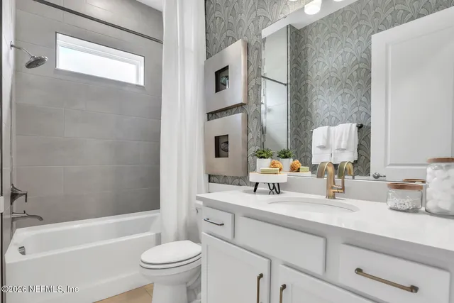 a bathroom with a sink a toilet and a bathtub