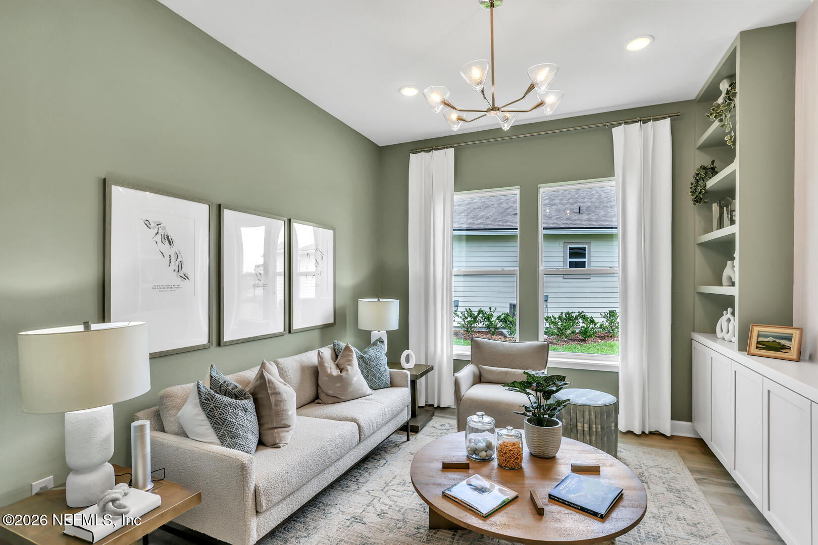 44 Ribera Drive Flagler Beach, FL 32136 - Photo 6 of 26 a living room with furniture kitchen and a chandelier