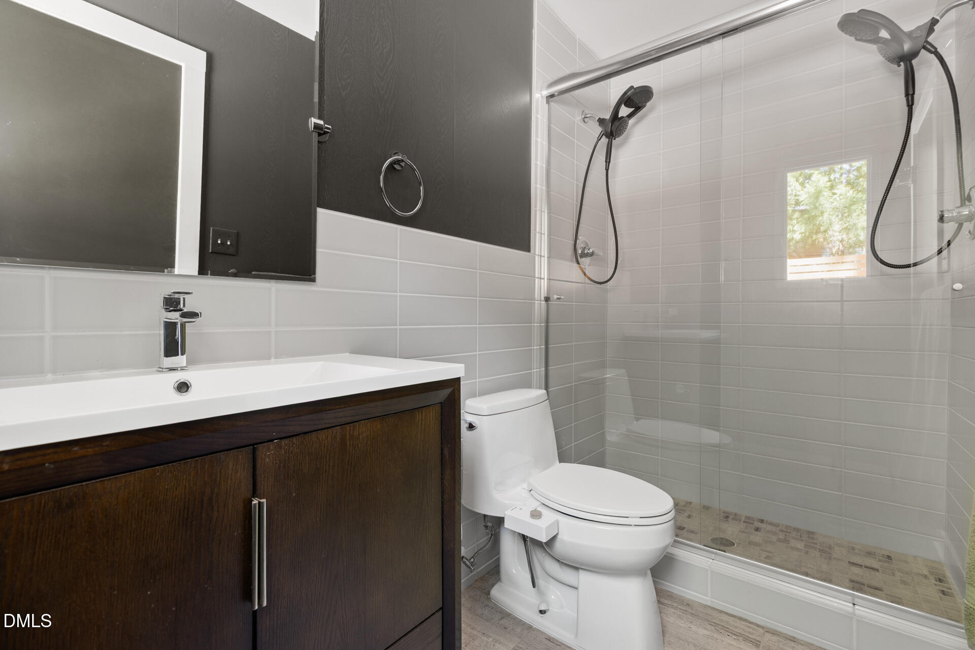 5208 Saddle Court Raleigh, NC 27609 - Photo 28 of 43 a bathroom with a sink a toilet and shower