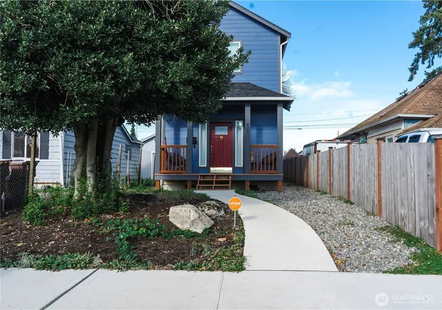 a front view of a house with garden