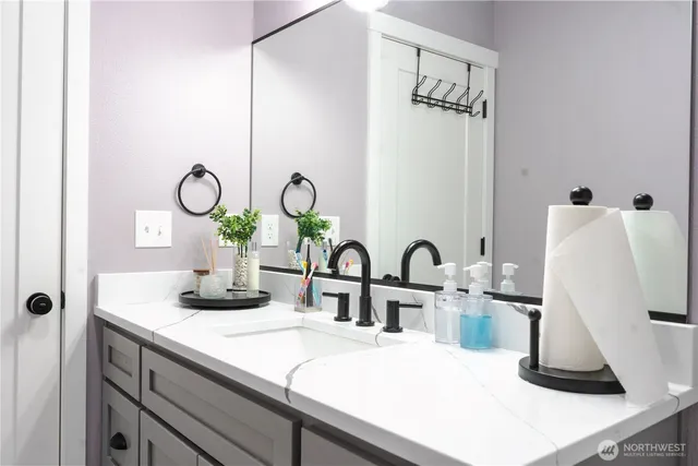 a bathroom with a sink and a mirror