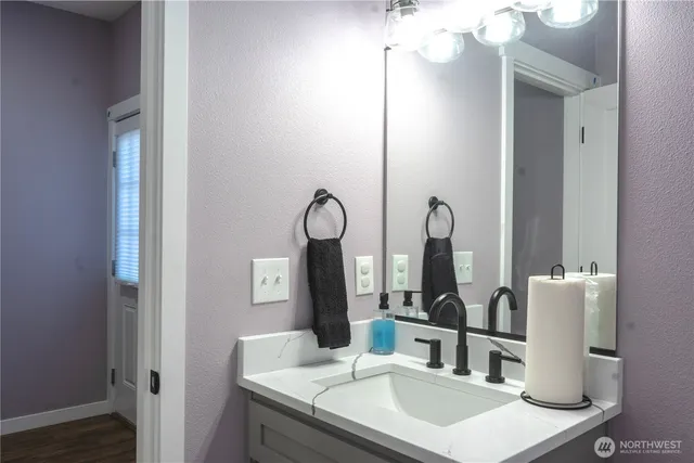 a bathroom with a sink and a mirror