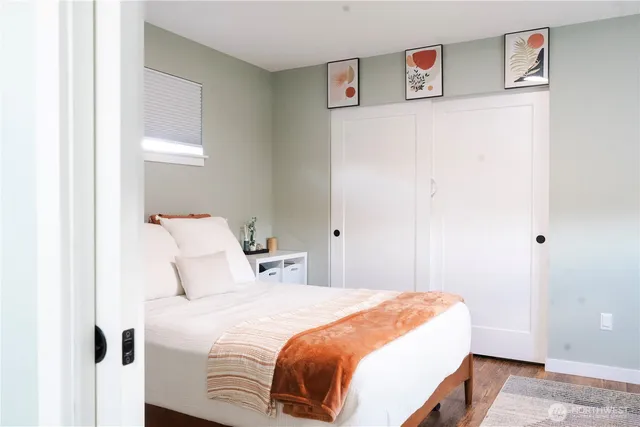 a bedroom with a bed and a window