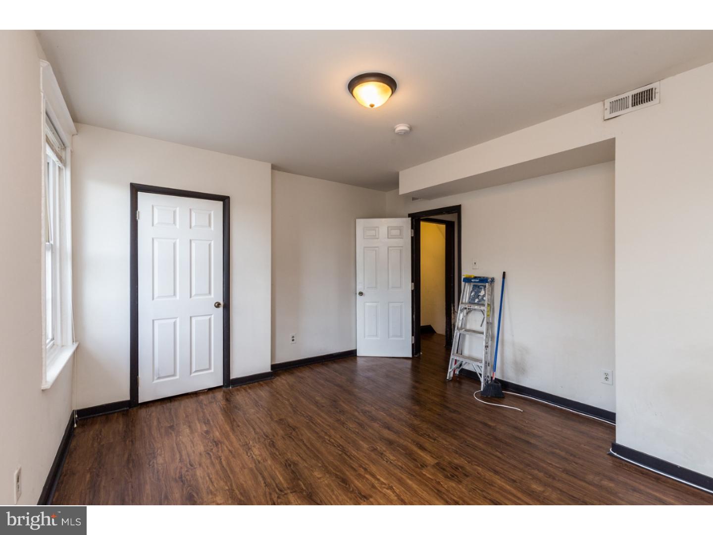 5013 Chester Avenue, Unit 3 Philadelphia, PA 19143 - Photo 14 of 17 a view of an empty room with wooden floor