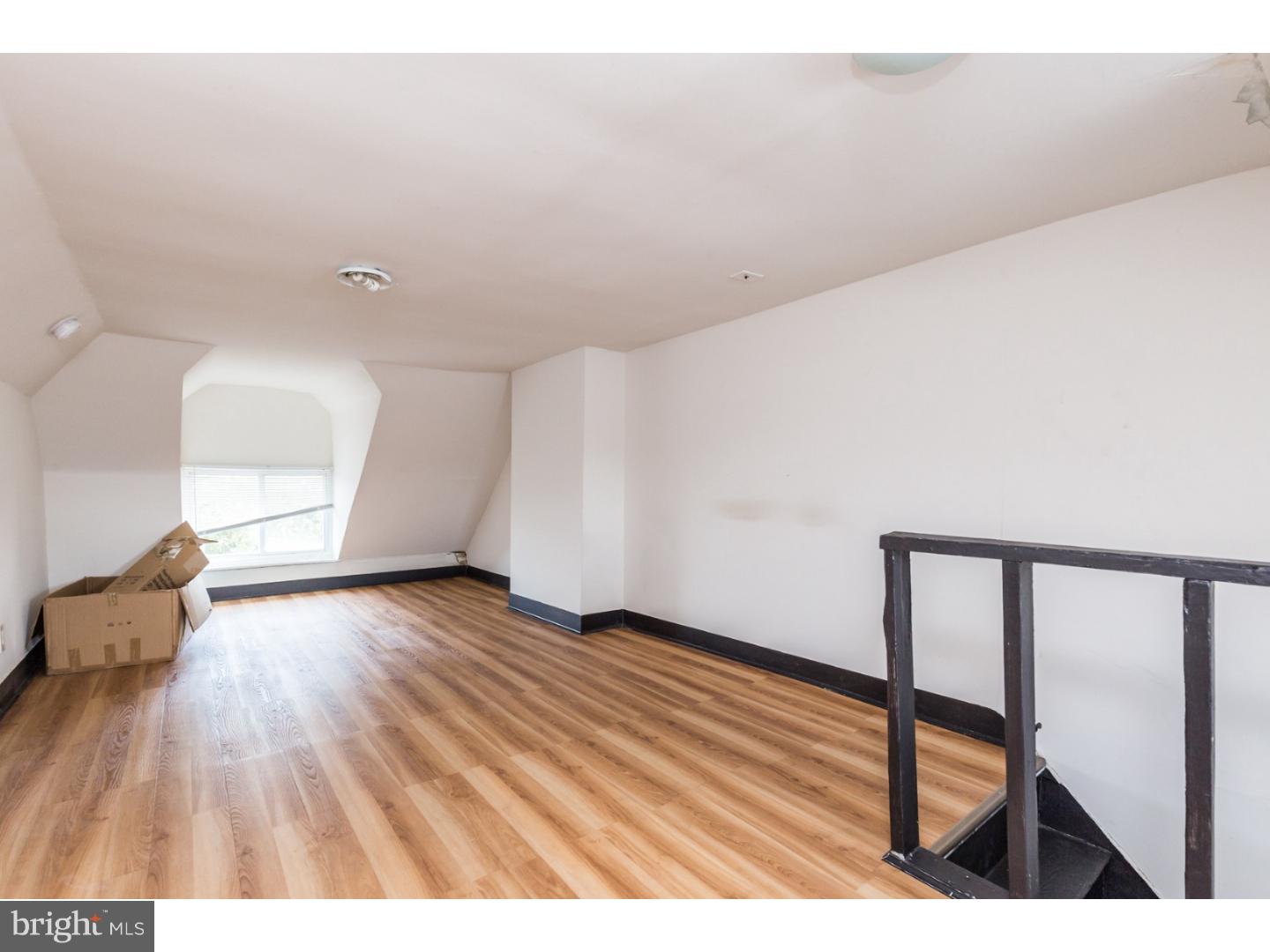 5013 Chester Avenue, Unit 3 Philadelphia, PA 19143 - Photo 2 of 17 a view of an empty room and wooden floor