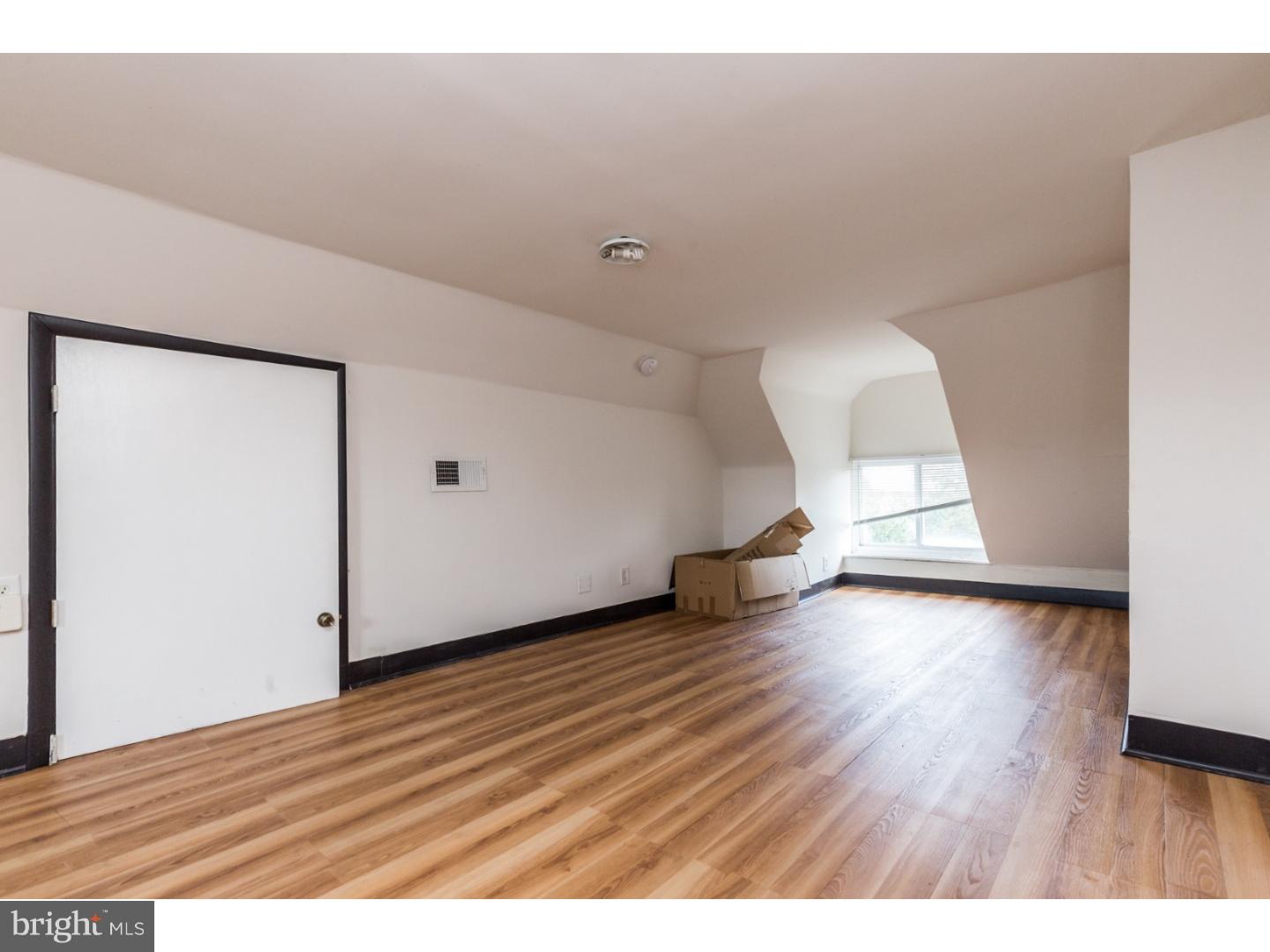 5013 Chester Avenue, Unit 3 Philadelphia, PA 19143 - Photo 3 of 17 a view of empty room with wooden floor