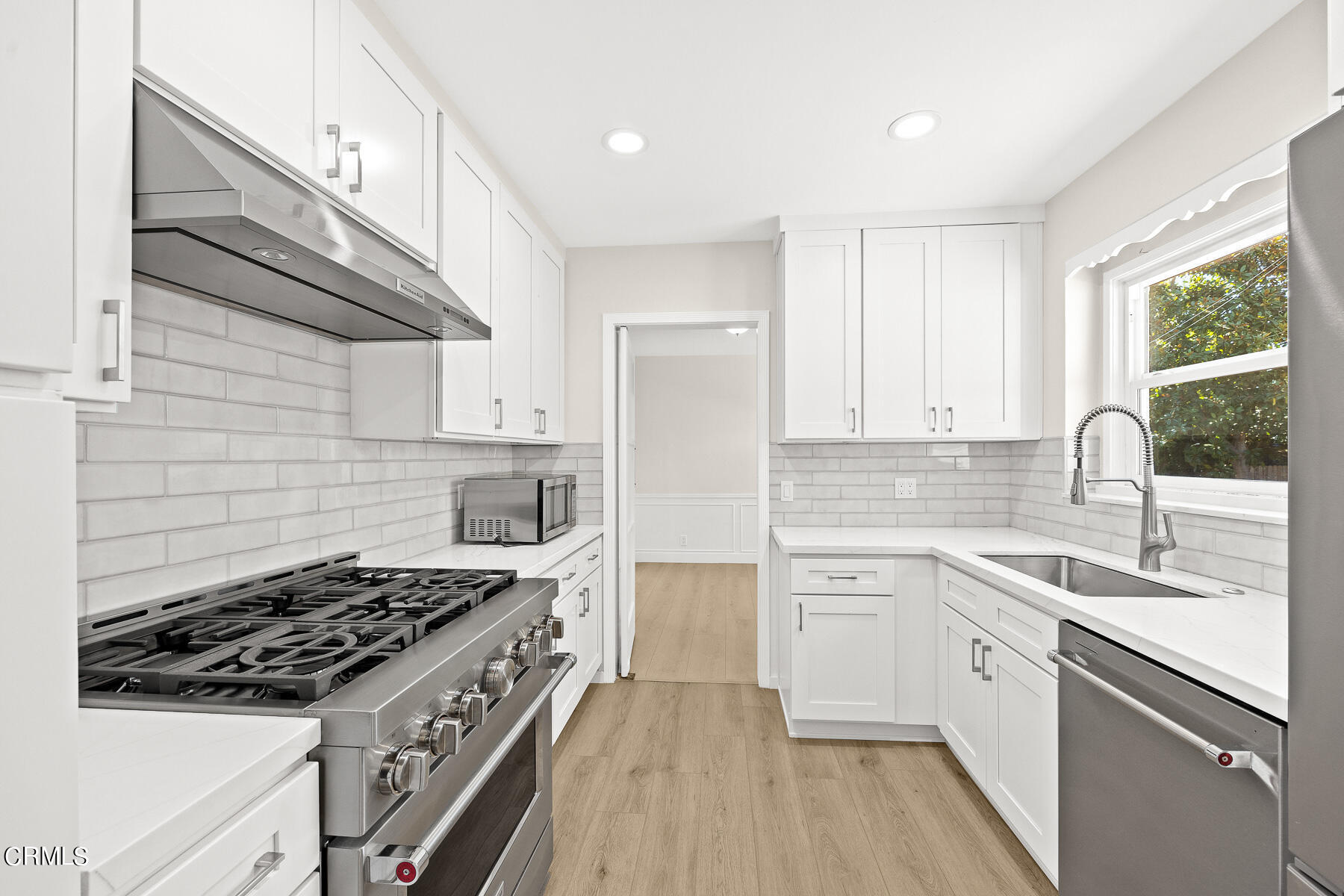 619 Corwin Avenue Glendale, CA 91206 - Photo 20 of 44 a kitchen with a sink stove and cabinets