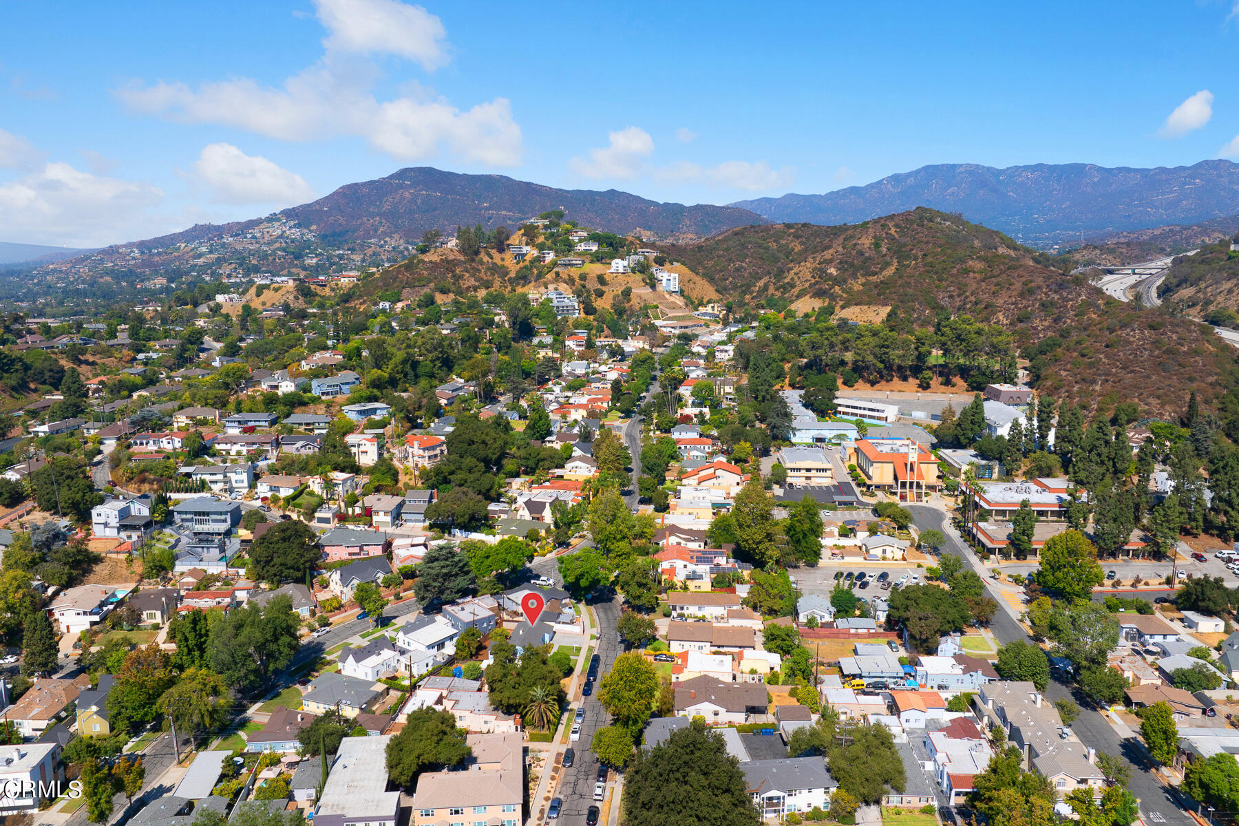 619 Corwin Avenue Glendale, CA 91206 - Photo 39 of 44 an aerial view of a city with lots of residential buildings and mountain view in back