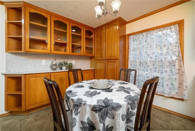 a kitchen with stainless steel appliances kitchen island granite countertop a sink and cabinets