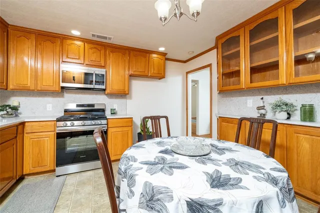 a kitchen with a sink and a refrigerator