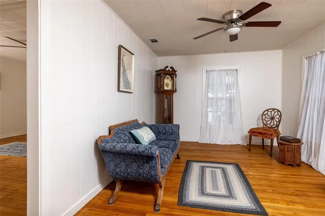 a spacious bedroom with a bed and a table in it