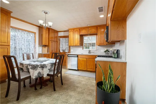 a view of a dining room with furniture window and outside view