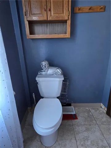 a bathroom with a toilet and a sink