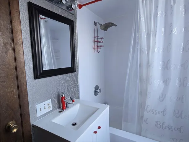 a bathroom with a sink and a mirror