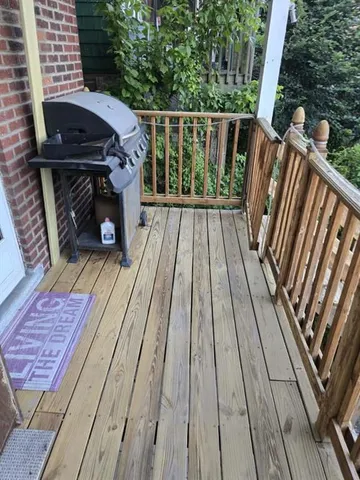 a view of deck with wooden floor and outdoor seating