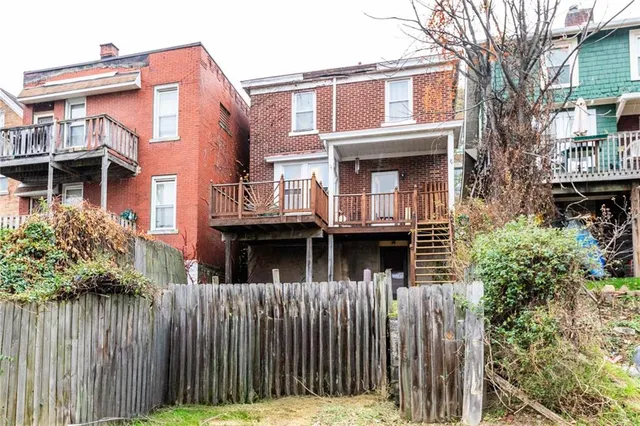 a view of a large building with a small yard