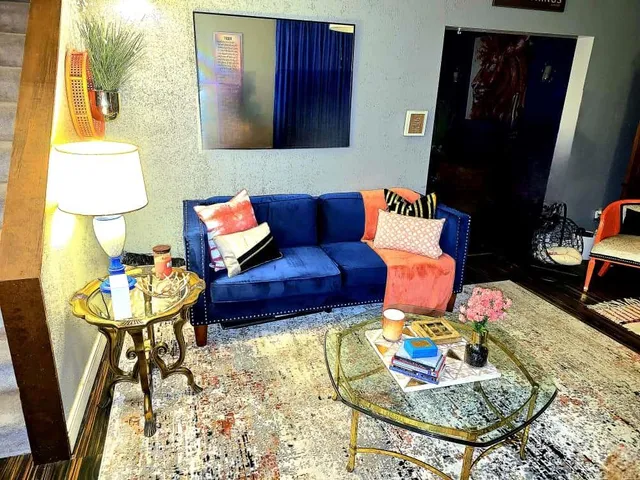 a living room with furniture and a rug