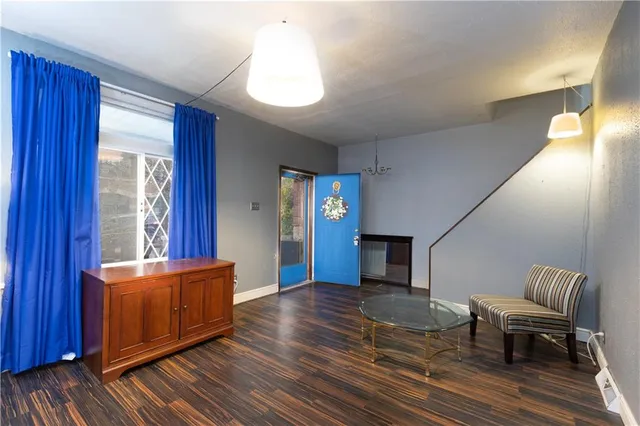 a view of a livingroom with furniture and wooden floor
