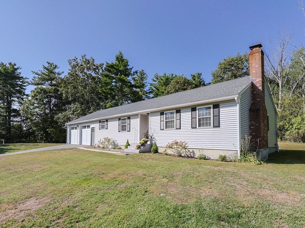 123 Harris Road Ashburnham, MA 01430 - Photo 1 of 32 a house with trees in the background