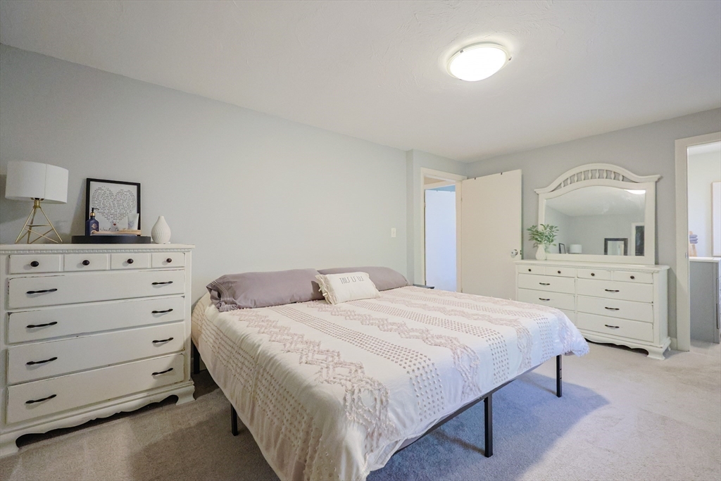 123 Harris Road Ashburnham, MA 01430 - Photo 12 of 32 a bedroom with a bed and a dresser