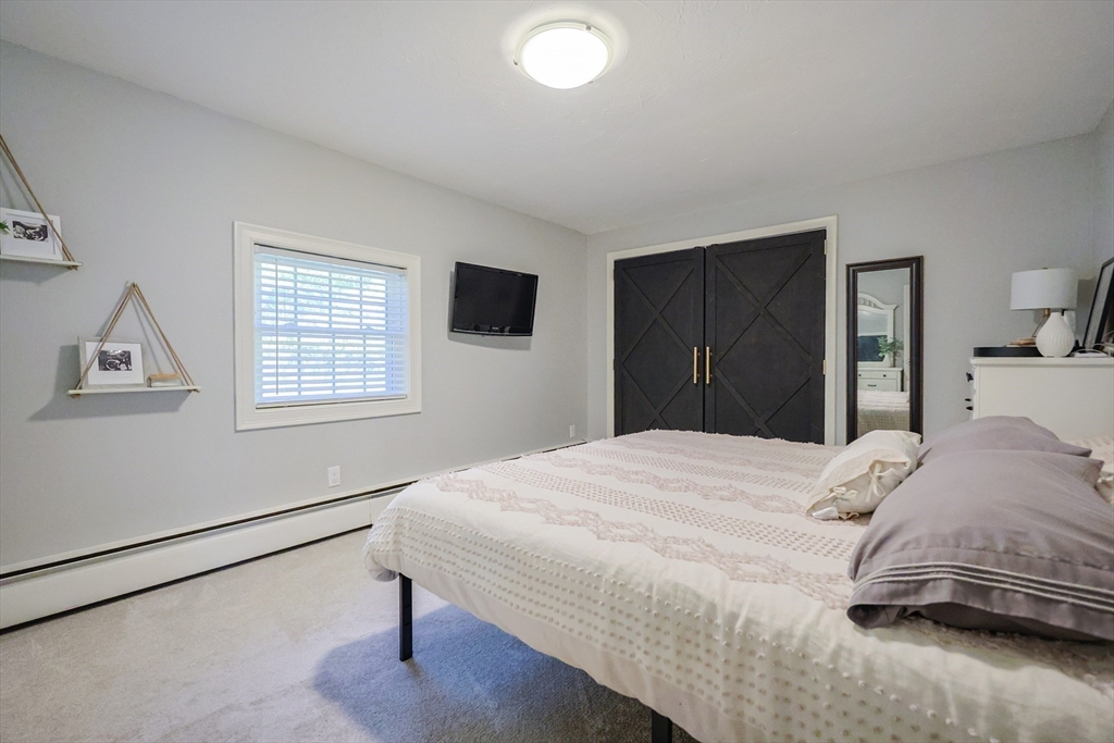 123 Harris Road Ashburnham, MA 01430 - Photo 13 of 32 a bedroom with a bed and a window