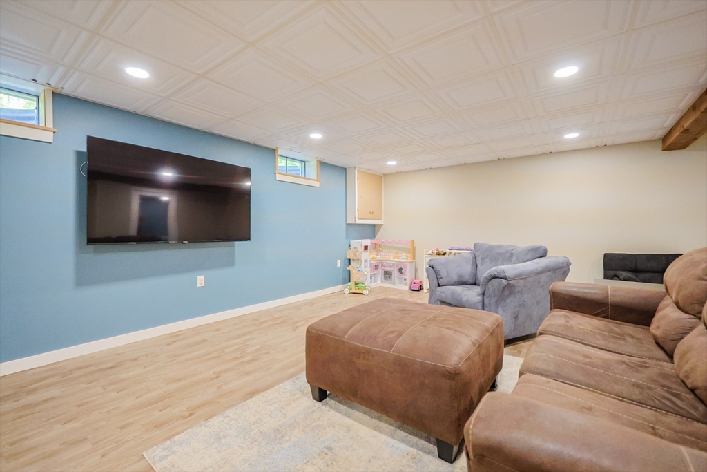 123 Harris Road Ashburnham, MA 01430 - Photo 18 of 32 a living room with furniture and a flat screen tv