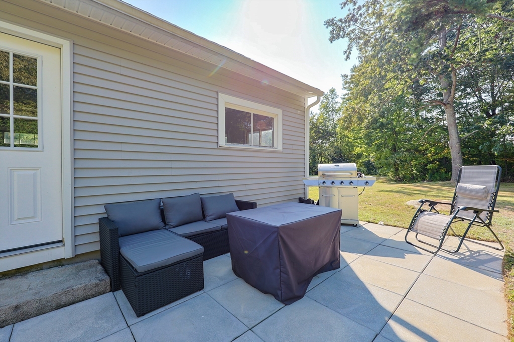 123 Harris Road Ashburnham, MA 01430 - Photo 28 of 32 a view of a patio with a table and chairs and couches