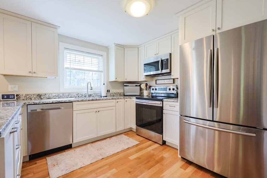 123 Harris Road Ashburnham, MA 01430 - Photo 10 of 32 a kitchen with granite countertop stainless steel appliances a refrigerator microwave and sink