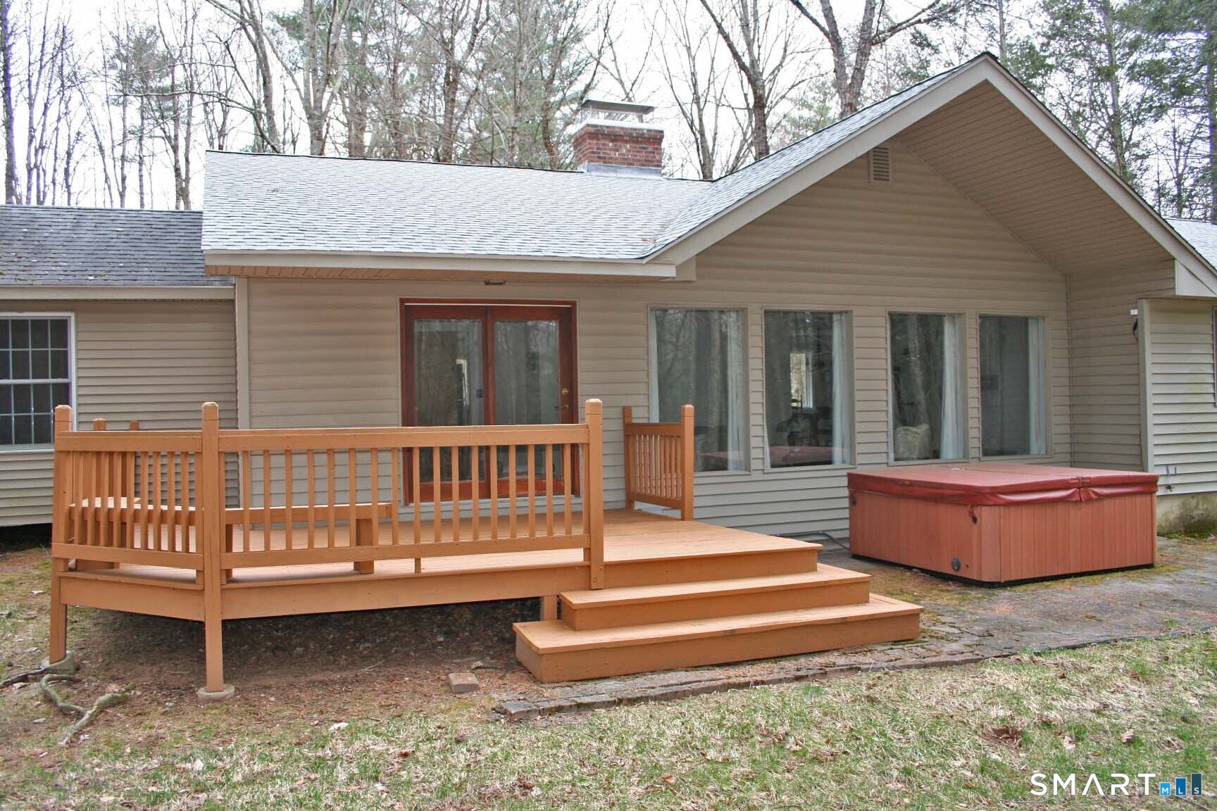 123 Old North Road Winchester, CT 06098 - Photo 26 of 28 Deck has steps to a patio with a hot tub