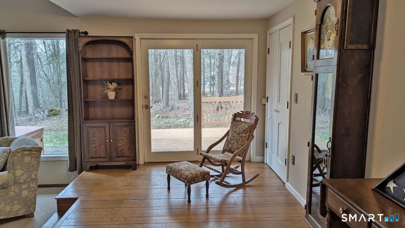 123 Old North Road Winchester, CT 06098 - Photo 6 of 28 This raised area of the living room could be used as a dining area. It has a slider to the deck