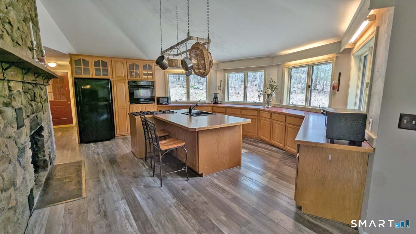 123 Old North Road Winchester, CT 06098 - Photo 7 of 28 Cathedral ceiling. Island breakfast bar. Granite counters.