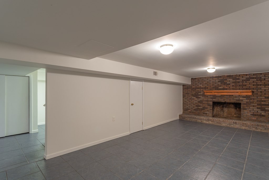 1694 Nickelsville Road Resaca, GA 30735 - Photo 54 of 58 an empty room with a fireplace