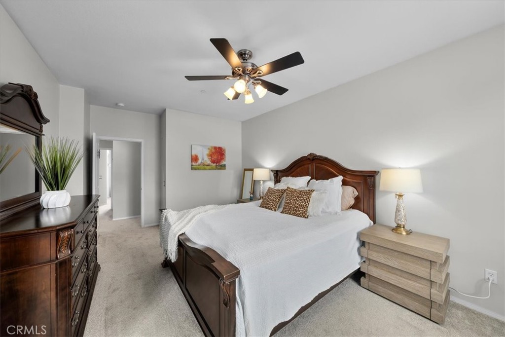 5565 Ocean, Unit 103 Hawthorne, CA 90250 - Photo 28 of 56 a bedroom with a bed and a chandelier