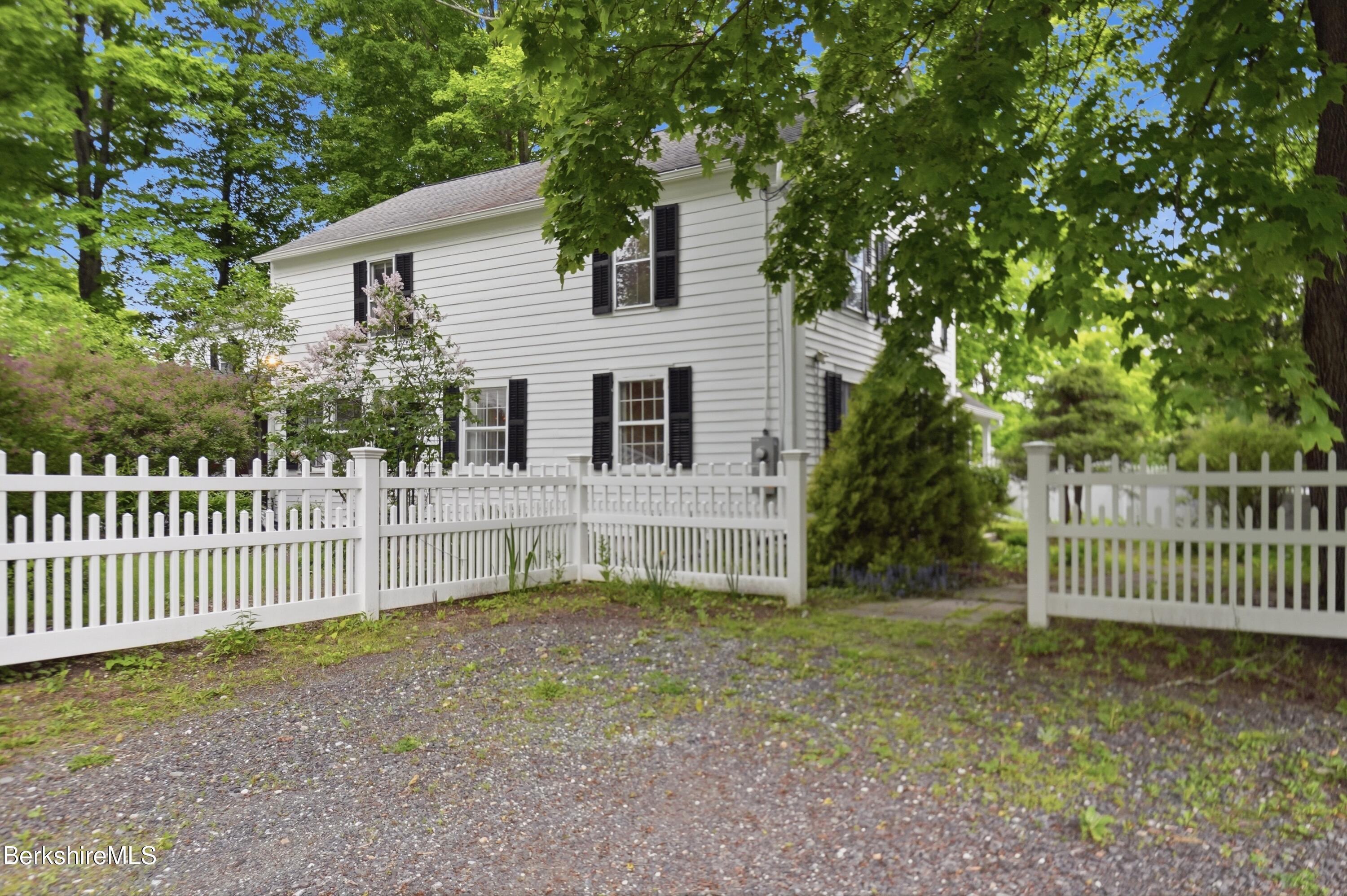 4 Stockbridge Road West Stockbridge, MA 01266 - Photo 6 of 94 a house that has a tree in front of it with wooden fence