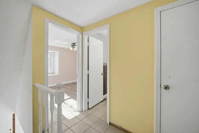 a bathroom with a glass shower door and a glass door