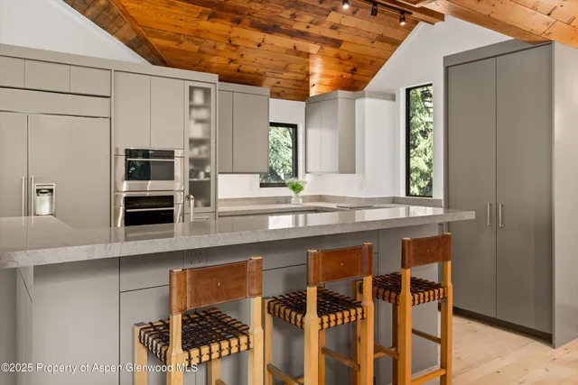 a bathroom with a tub sink and window
