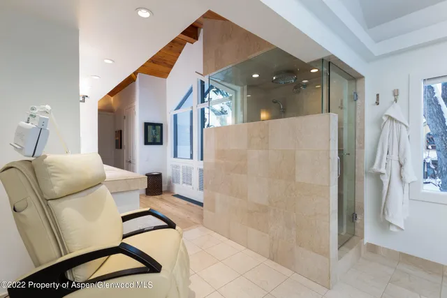 a spacious bedroom with a large bed and a couch