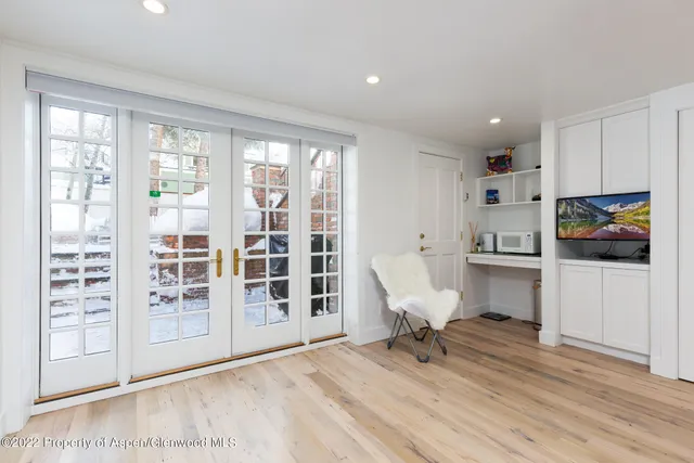a bathroom with a double vanity sink a mirror and a shower