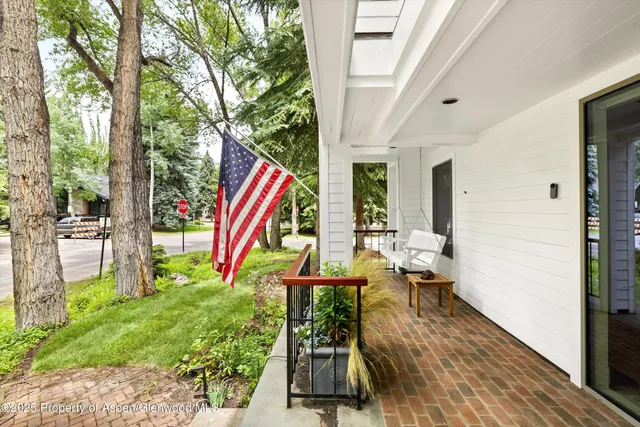 a view of balcony with furniture