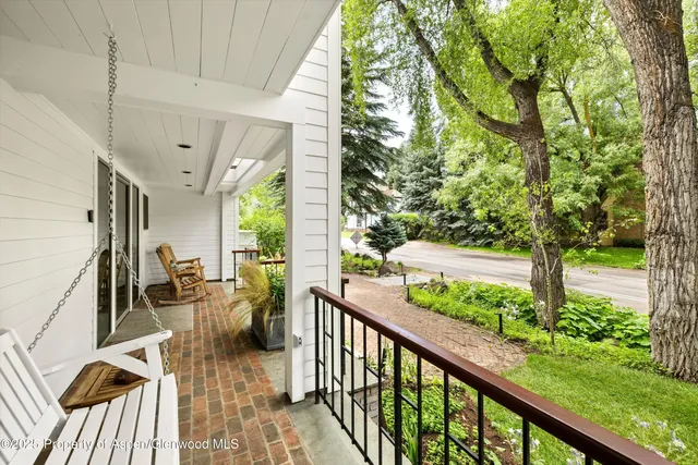 a view of a patio with two chairs and a table