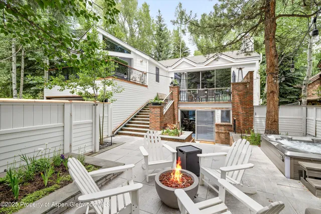 a view of an outdoor sitting area with furniture