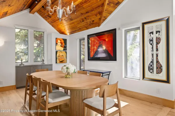 a dining room with furniture and window