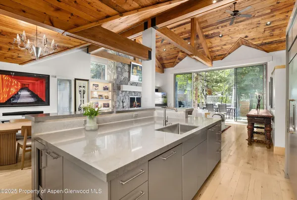 a kitchen with stainless steel appliances a sink and a microwave