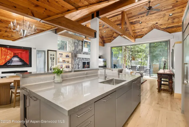 a kitchen with stainless steel appliances a sink and a microwave