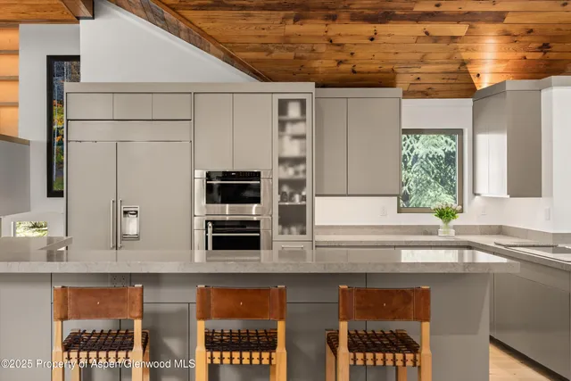 a kitchen with a table and chairs in it