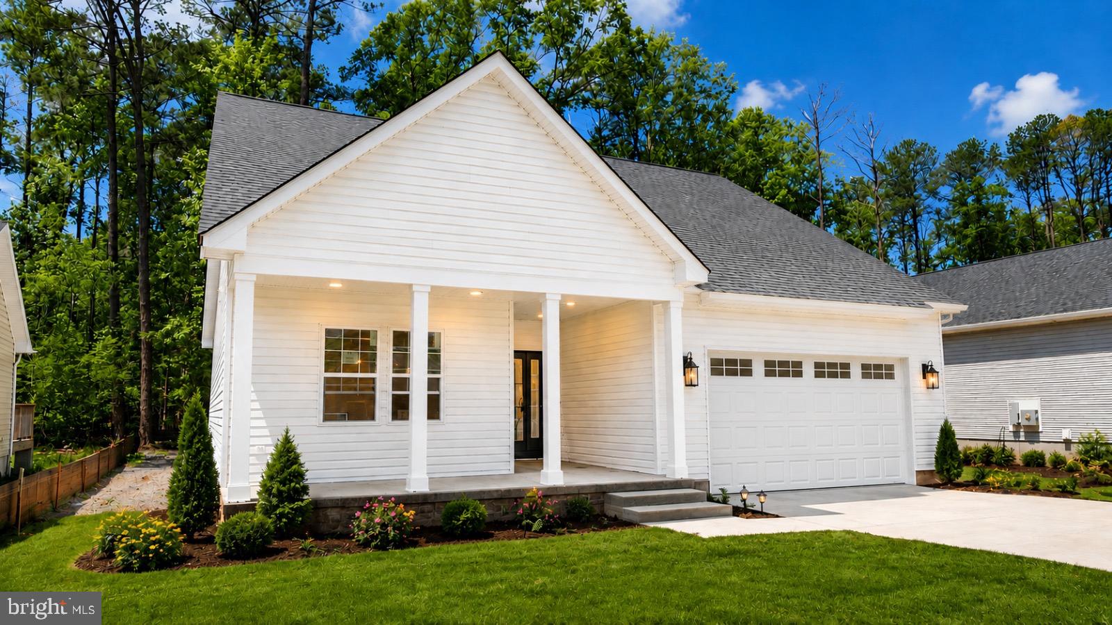 a view of a house with backyard and garden