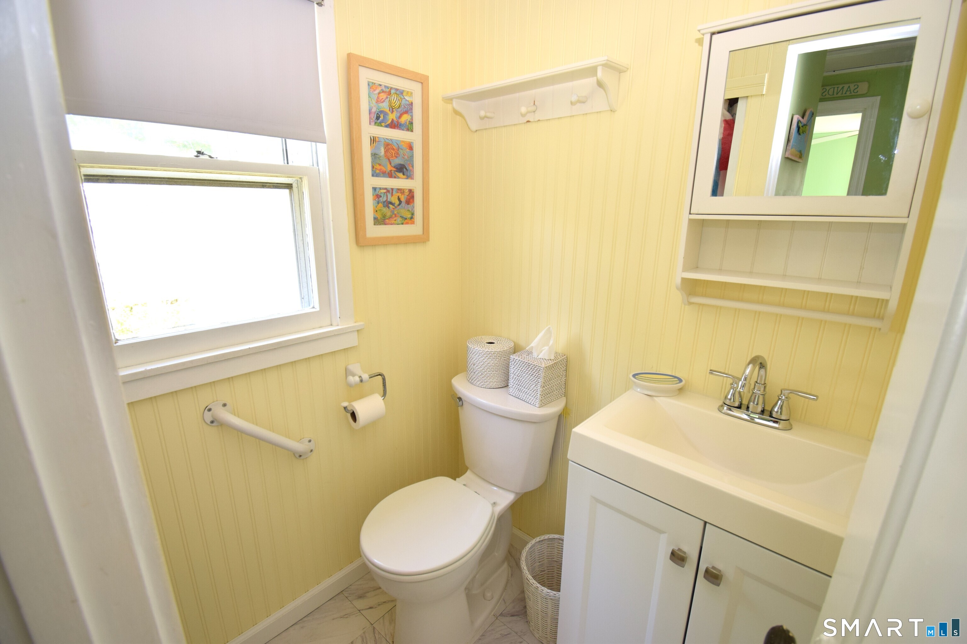 50 East Street Madison, CT 06443 - Photo 15 of 26 a bathroom with a sink and a mirror